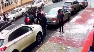 Man Knocked Unconscious by Falling Chunk of Ice In China.