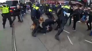 Dutch Anti-Lockdown Protester Is Mauled by Police Dogs.