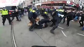 Dutch Anti-Lockdown Protester Is Mauled by Police Dogs.