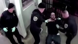 Handcuffed Man Spits on Two Police Officers, Face Gets Caved in with Punches