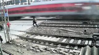 Dude Survives Getting Almost Hit By Train at Speed 130+ KMPH 