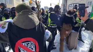 Trudeau's Jack Boot Thugs Beat A Freedom Convoy Protester With The Butt Of A Rifle