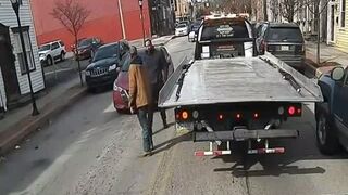 Shocking Video Shows Violent Punch that Drops Tow Truck Driver