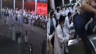 Chinese Workers Storm Barricades, After Being Locked in iPHone Factory Forced to Work