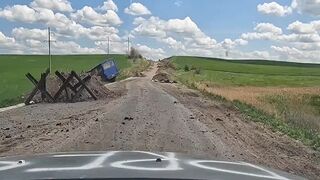 Driving Through Donbas as Mortar Fire Explodes Around Him