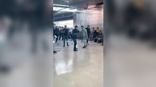 Shocking Moment a Man Is Stamped on the Head In Dublin Airport's Departures Terminal Following Mass Brawl as Families Cower In Terror