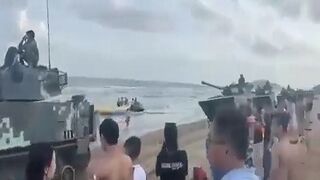 Tanks Roll into a Chinese Beach... Ahhhh That Wonderful Communism! smdh