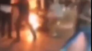 Iranian Police Officer Set on Fire During Massive Rioting.