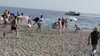 Beachgoers Tackle Drug Runners That Landed Their Boat on a Beach!