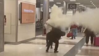 Lunatic Woman Sprays Fire Extinguisher at Delta Employees in Atlanta!