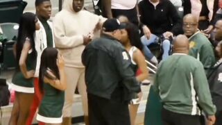 Cheerleader Thrown Out of a Game for Going After a Player She Thought Touched Her.