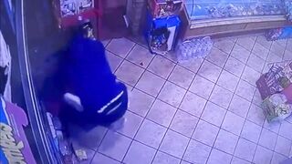 Man Knocks a Female Clerk Out With a Metal Pipe!