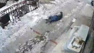 DAMN: Snow Cracks a Man's Skull as He Stands on the Sidewalk!