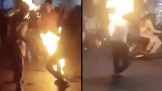 "Fire Eater" Accidentally Engulfs Himself & His Friend in Flames!