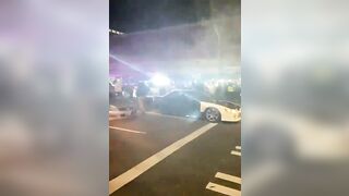 Cop car decides its had enough. Just runs over a bunch of people standing in its way.