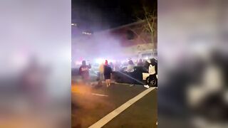 Cop car decides its had enough. Just runs over a bunch of people standing in its way.