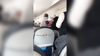 Two Dudes Brawl in the Airplane Aisle and on Top of Passengers