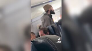 Dorky Man Terrorizes Plane Mid-Flight with a Spoon.. Gets Manhandled by Passengers