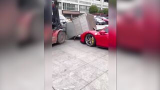 Forklift Driver Accidentally Dropped an Oven Onto The Hood of a Parked Ferrari