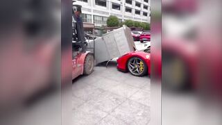 Forklift Driver Accidentally Dropped an Oven Onto The Hood of a Parked Ferrari