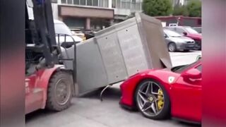 Forklift Driver Accidentally Dropped an Oven Onto The Hood of a Parked Ferrari