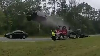 Car Literally Takes Flight when Distracted Driver Doesn't See Tow Truck