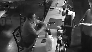 Guy at Bar isn't Phased one Bit During Robbery Just Drinks his Drink and Watches