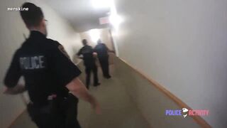 Police Officer Shoots Axe-Wielding Man in Apartment Building Hallway!
