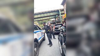 Woman Punks Two NYPD Cops Blocking Traffic! "Clowns In Costume"