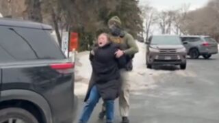 The cuffed woman tries to bolt and eats pavement HARD