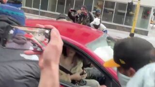 Jake Lang FLEES anti-Islam protest by car in Minneapolis after violent leftists caused his head to bleed and chased him down the street