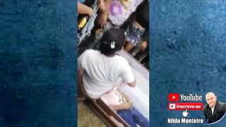 Woman in Panties gives Lap Dance to Dead Man with Open Casket