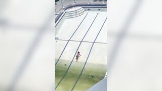 Airhead Girl Swimming in an Empty Pool with Green Water