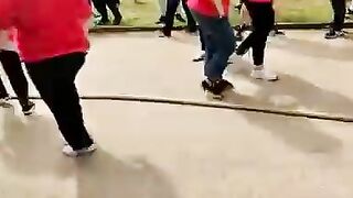 Woman pulls the Wrong Way in a tug-a-war match (No Joke)