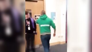 Father Storms School Holding a Drag Story with a Guard at the Door.