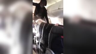 Woman LOSES her Mind on Airplane...Turns into Spiderman