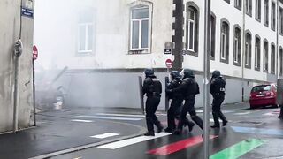 Bumbling Riot Police Tripped up by Makeshift Tripwire just Laying There