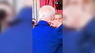 Conspirators Claim this Video shows Biden Wears a Mask