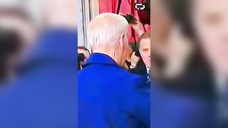 Conspirators Claim this Video shows Biden Wears a Mask