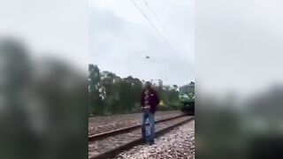 No Idea he's about to get Hit by a Train