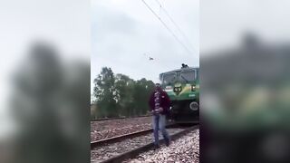 No Idea he's about to get Hit by a Train