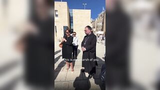 German Priest gets told by an Israeli guard to cover his cross during a Jerusalem tour