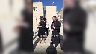 German Priest gets told by an Israeli guard to cover his cross during a Jerusalem tour