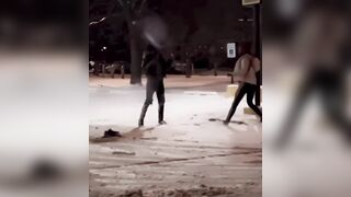 Man and his girl getting into a tussel outside in the freezing cold