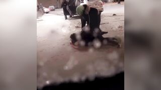 Man and his girl getting into a tussel outside in the freezing cold