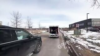 Jake Lang rides in a U-Haul outside the Bishop Henry Whipple Federal Building in MN