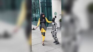 Cardi B giving a lap dance to a robot until it falls on top of her