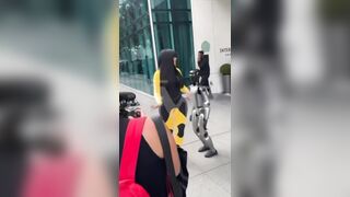 Cardi B giving a lap dance to a robot until it falls on top of her