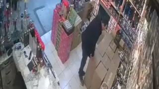 The suspended ceiling collapsed on the business owner; the moment was caught on camera.