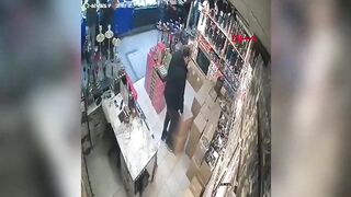 The suspended ceiling collapsed on the business owner; the moment was caught on camera.